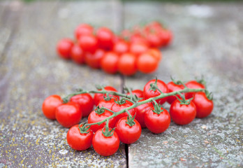 Cherry tomatoes on rustic wooden table