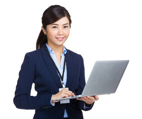 Business woman type on laptop