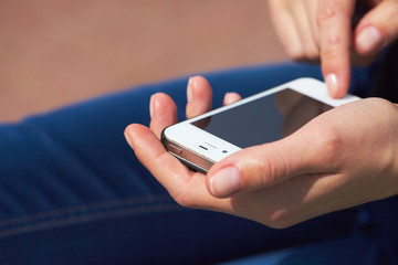 woman's hands with mobile phone