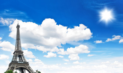 Eiffel Tower against cloudy blue sky