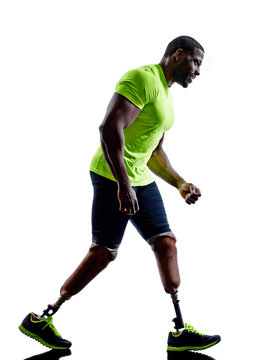 handicapped man joggers runners running with legs prosthesis sil