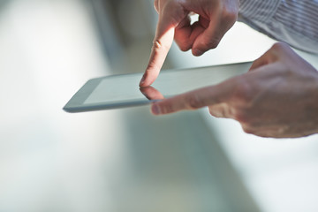 man holding digital tablet