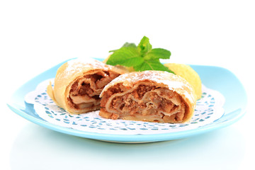 Tasty homemade strudel on plate isolated on white