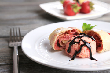 Tasty homemade strudel with ice-cream, fresh strawberry and