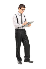 Classy man writing on a clipboard