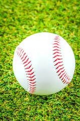 Baseball on green grass