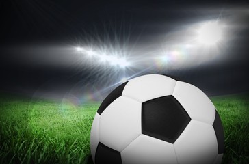 Fototapeta na wymiar Composite image of black and white football