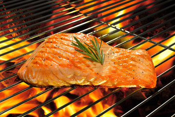 Grilled salmon on the flaming grill. © amenic181