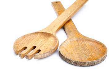 Wood spoons and fork on white background