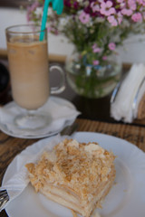 Cup of coffee, cake and spring flowers