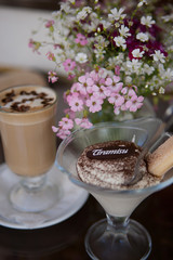 Cup of coffee, cake and spring flowers