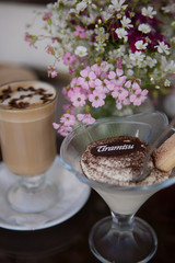 Cup of coffee, cake and spring flowers
