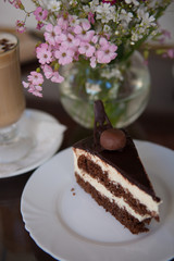 Cup of coffee, cake and spring flowers