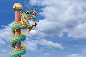 Dragon pole against the blue sky