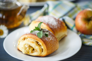 sweet apple muffins with powdered sugar and mint