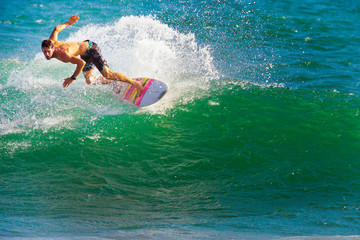 Surfer on Blue Ocean Wave in Bali
