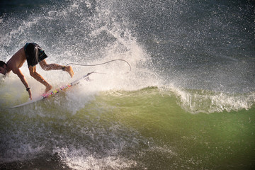 Surfer on Blue Ocean Wave in Bali