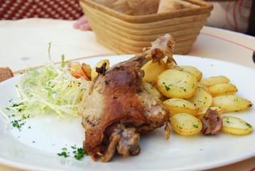 Roast Duck leg with potato and salad