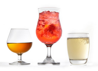 three glasses of various drinks