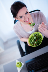 cheerful young business woman fresh salad lunch break office