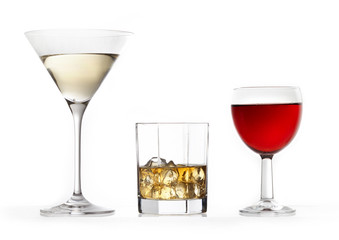 three glasses of various drinks
