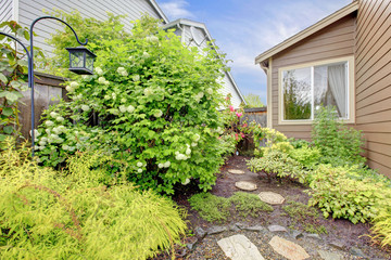 House exterior with landscape