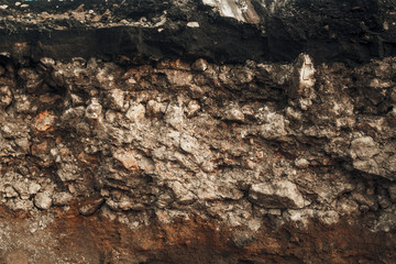 Layers of sand and stones under the asphalt.