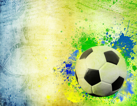 The Brazil flag and soccer ball on grunge background