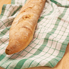 Baguette bread over the towel