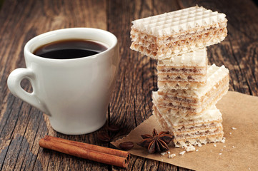 Cup of coffee and sweet waffles