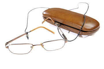 Eye glasses next to its case