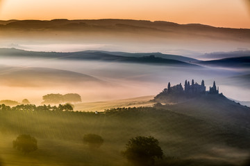 Beautiful sunrise over the valley of olive groves and vines