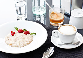 Semolina porridge in a plate with fresh strawberries. Health Bre