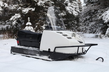 snowmobile in winter forest