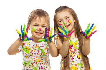 Little kids with hands painted in colorful paint