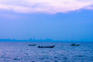 Fishing motorboats at Pattaya bay in the evening