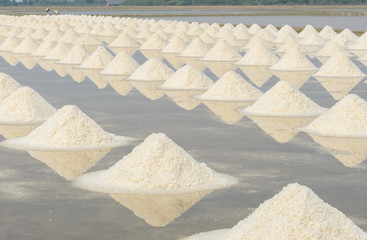 Heap of sea salt in evaporation pond, Thailand