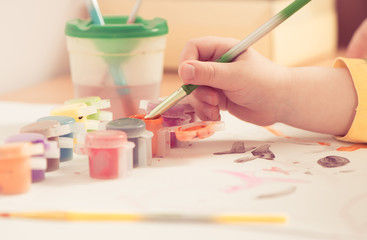 painting tassel in boy hand