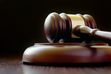 Gavel laying on its side on sounding block