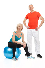 Obraz na płótnie Canvas blond woman sitting on fitness ball.