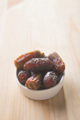 Date palm fruits or kurma, ramadan food  vintage retro effect.