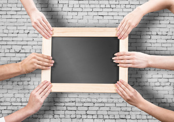 Hands holding frame