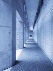 Concrete hallway in blue