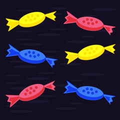 Multi-colored candy on a dark blue background