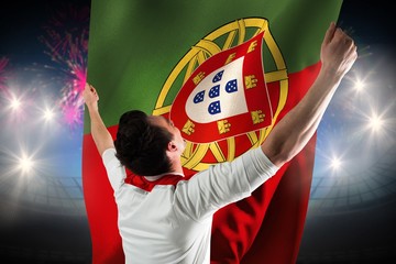 Composite image of excited football fan cheering