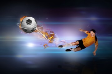Fototapeta na wymiar Composite image of football player in orange kicking