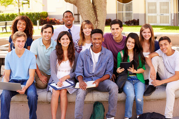 Portrait Of High School Students With Teacher On Campus