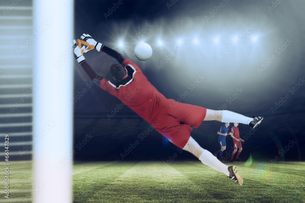 Poster Composite image of goalkeeper in red jumping up