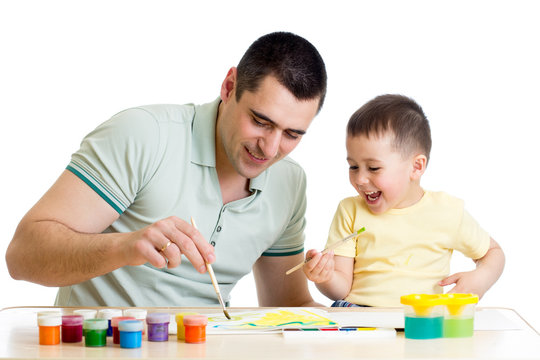 kid boy and dad paint together isolated on white
