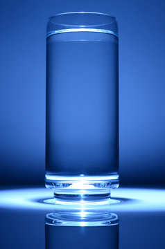 glass of water with blue spot light